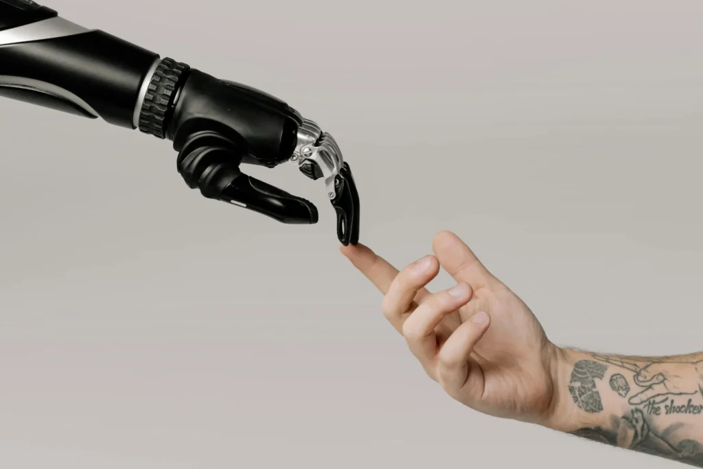 Black Robot hand with Human hand