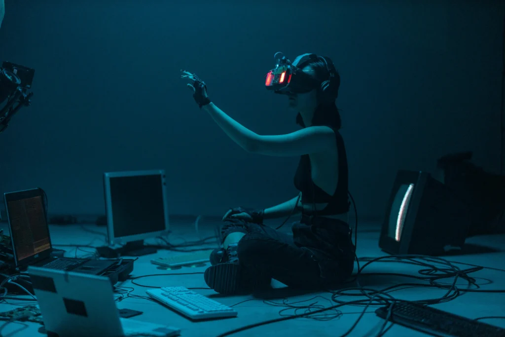 Girl with VR glasses and computers